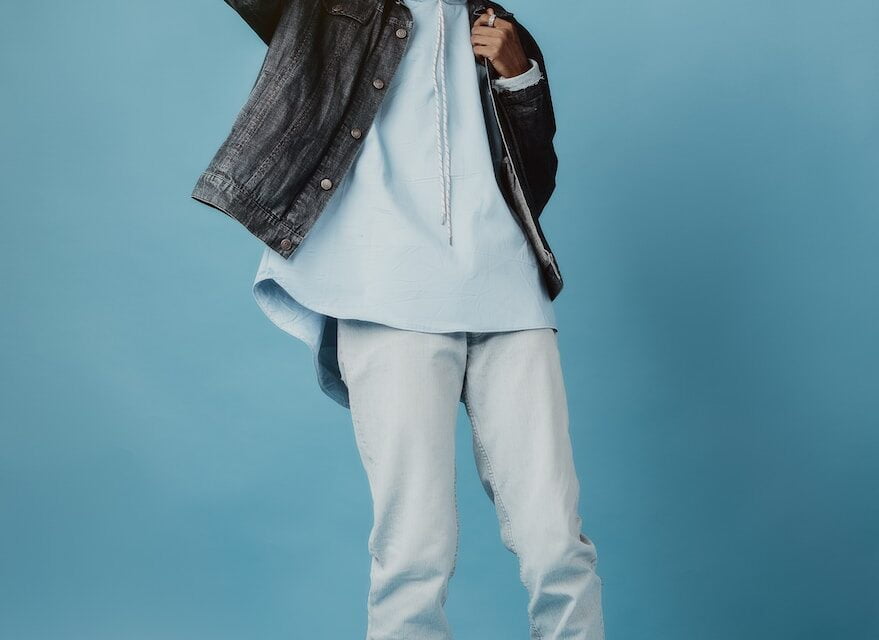 a male in a white shirt and a black jacket